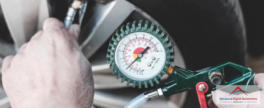 ADAG - Person Checking Tire Pressure