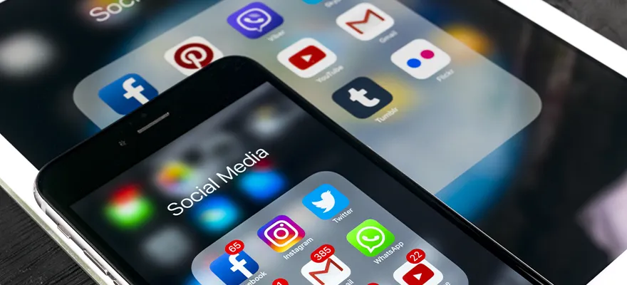 Apple iPhone 7 and iPad Pro displaying popular social media icons including Facebook, Instagram, Twitter, and Snapchat, representing the diverse platforms used for content distribution.