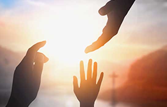 Hands reaching out to each other indicate the important human virtue of helping others in need.The sunlight spills across the landscape, illuminating everything it touches with a soft golden glow.